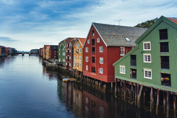 Naklejka premium Colorful Bryggen Wharf Houses Reflecting on the Nidelva River in Trondheim