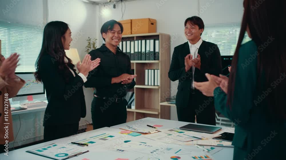 Poster diverse colleagues, gathered around a table with charts and sticky notes, express their appreciation