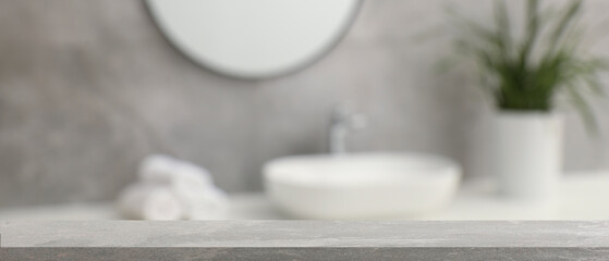Empty table in bathroom, blurred background. Space for design