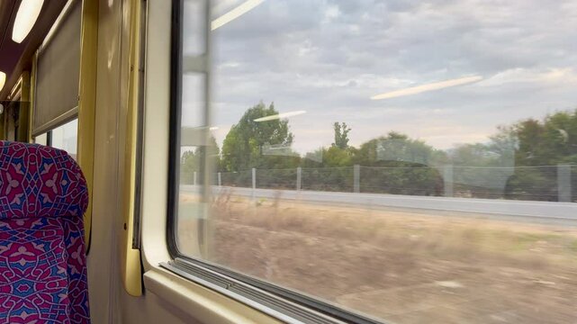 Empty seat with a window view from a moving train in Morocco