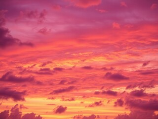Fototapeta premium Abstract sky filled with vibrant hues of orange, pink, and purple at sunset, clouds, atmospheric