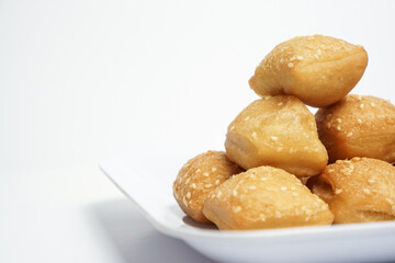 Odading, a box-shaped fried bread that expands like a pillow, with a like brown crispy outer shell...