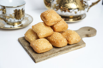 Odading, a box-shaped fried bread that expands like a pillow, with a like brown crispy outer shell...