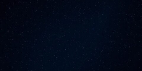 Fototapeta premium Starry night sky filled with twinkling stars on a dark background, cosmic, stars, beauty