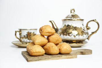 Odading, a box-shaped fried bread that expands like a pillow, with a like brown crispy outer shell...
