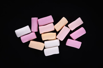 Marshmallow. Heap of colored marshmallows on a dark