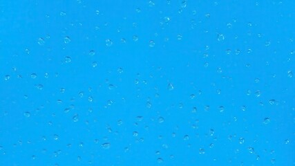 Water drops glistening on a vibrant blue background, creating a fresh and calming aesthetic, macro, serenity, aqua