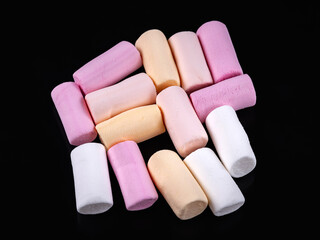 Marshmallow. Heap of colored marshmallows on a dark. Top view