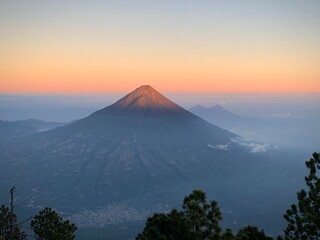 Fototapeta premium Volcano Illuminated by Rising Sun (Volcan de Acatenango, Guatemala)