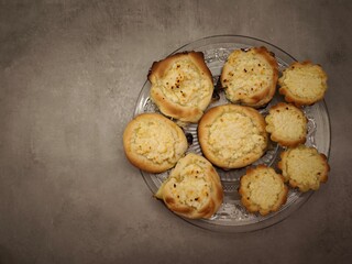 Delicious vatrushka buns with cottage cheese filling on glass plate in prague copy space