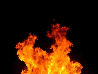 Fototapeta premium Abstract and intense fire flames dancing on a dark black background, creating a mesmerizing and dramatic scene, dark, power, black background