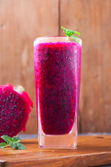 dragon fruit juice on a wooden background