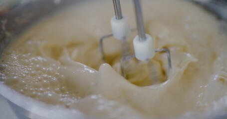 Close-Up of Mixer Blades Mixing Pancake Batter