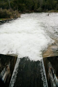 Water Flowing Out of Flood Gate Close-Up, Powerful Stream in Motion
