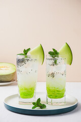 ice melon nata de coco, a drink with a cold sweet taste consisting of a mixture of melon syrup, melon fruit, nata de coco, basil seeds and soda