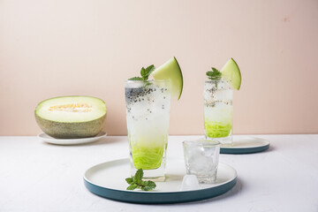 ice melon nata de coco, a drink with a cold sweet taste consisting of a mixture of melon syrup, melon fruit, nata de coco, basil seeds and soda