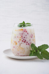 Mixed Ice (Es Campur, made from gelatin, tapioca pearls, ice, young coconut, sugar syrup, mixed fruit and coconut milk or milk. hemp during the month of Ramadan. Indonesian street food