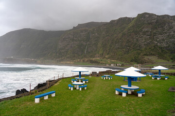 Stone table and benches in the picnic area on the island of flowers of the archipelago of the Azores