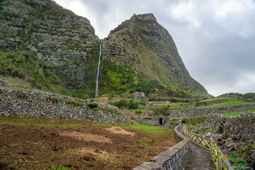 Fototapeta premium Pedestrian access path to the cascade of the codfish well on the island of flowers of the archipelago of the Azores