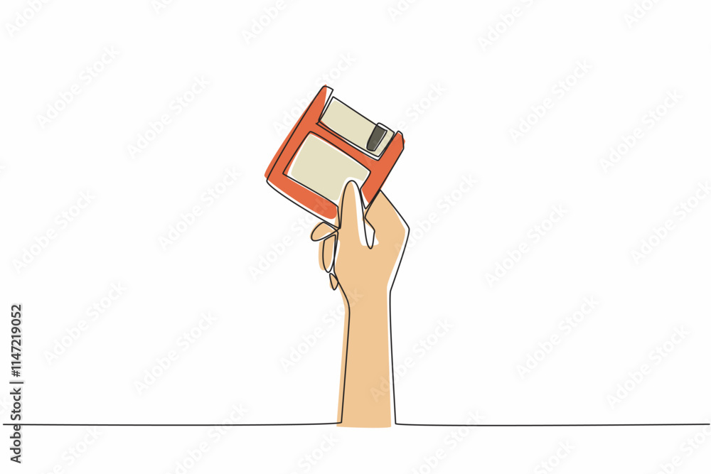 Poster single one line drawing hand holding a floppy disk. ancient storage technology. small storage size. 
