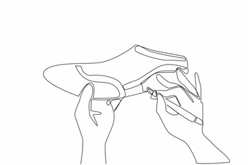 Single continuous line drawing two hands drawing a pattern on surface of a shoe using a marker. Beautiful art even when placed on a footrest. National Handmade Day. One line design vector illustration