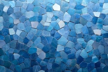 A mosaic of various shades of blue stones arranged in a decorative pattern.
