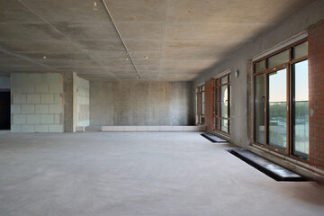 The spacious, modern interior has large windows that enhance the urban experience