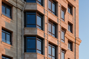 Innovative and Modern Architectural Design Featuring Elegant Windows and a Textured Facade