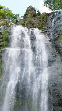 Waterfall in the tropical mountain jungle. Balea Falls in the jungle. Negros, Philippines.