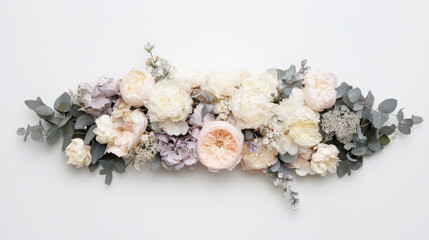 Obraz premium A symmetrical floral wreath shaped into an elongated oval, composed of muted lavender, blush pink