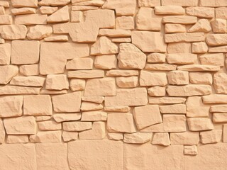 Abstract warm beige background resembling a textured rock wall, earthy, rock