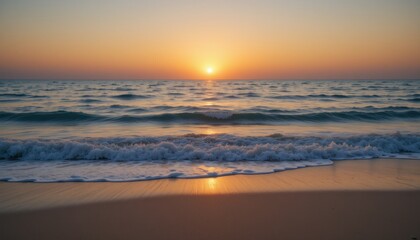 Serene sunset over gentle waves on a tranquil beach.