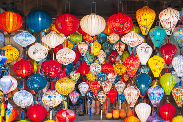 background with colorful Vietnamese silk lanterns in Vietnam in Asia in the old town on the streets of Hoi An city © alexkoral