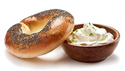 bagel with cream cheese and a bowl of cream cheese are isolated on white.