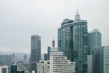Naklejka premium tall buildings with morning clouds in the background