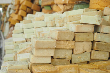An Array of Colorful Soap Bars Beautifully Stacked at a Market Stall