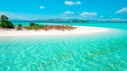 Beautiful beach with white sand, turquoise ocean, blue sky with clouds. summer background and summer vacation concept.