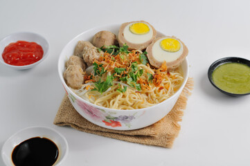 Mie bakso is an Indonesian noodle soup dish consists of bakso meatballs served with yellow noodles...