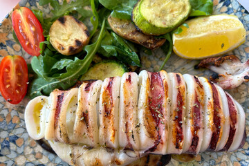 Grilled squid with salad and roasted vegetables