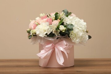 Bouquet of beautiful flowers on wooden table