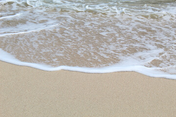 View of crashing waves washing the beach, background concept.