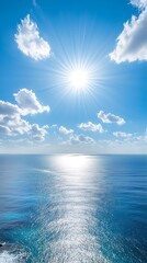 Obraz premium Sunset over the sea with rays of light shining through the clouds