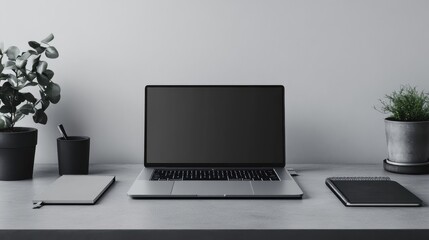 Fototapeta premium Monochromatic workspace with gray desk and laptop