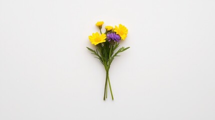 A small bouquet of colorful flowers featuring yellow and purple blooms set against a clean white background.