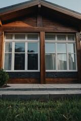 Exterior View of a Wood-Frame House with Multi-Pane Windows