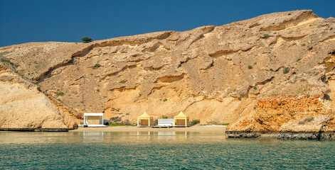Naklejka premium Beach and bay Gulf of Oman. Summer holidays and tourism in the Beautiful Arab country. Muscat, Oman