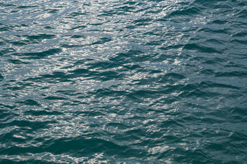 Deep blue sea texture background. Background of aqua sea water surface. Blue sea surface. Aqua water surface. Blue ocean water texture background. Surface of sea.