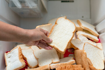 Food waste. The housekeeper threw away a large amount of expired bread in the refrigerator.