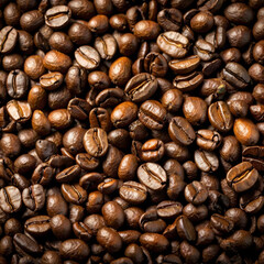Fototapeta premium Assorted coffee beans, including light roasted and dark roasted varieties, arranged in a textured background 