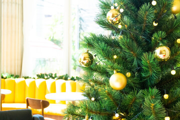 Christmas Tree with Decorations in cozy home interior,Festive image in holiday,Merry Christmas and Happy New Year..